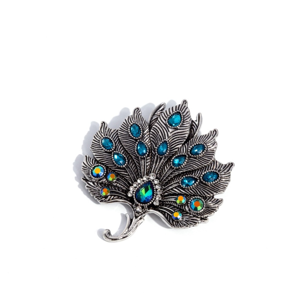 Elegant Silver and Blue Peacock Brooch